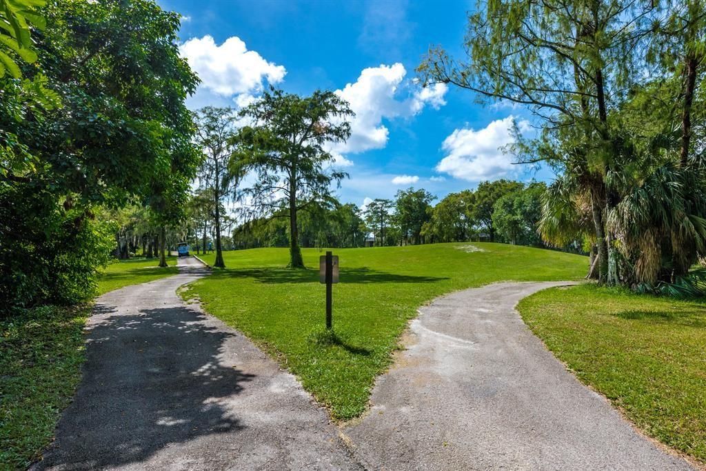 7925 Fairview Drive, Unit 101 Tamarac, FL 33321 - Photo 44 of 48 a view of a park with large trees