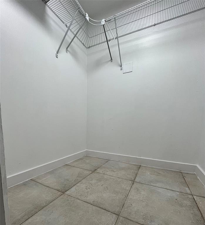 7925 Fairview Drive, Unit 101 Tamarac, FL 33321 - Photo 9 of 48 a view of a room with racks on the wall