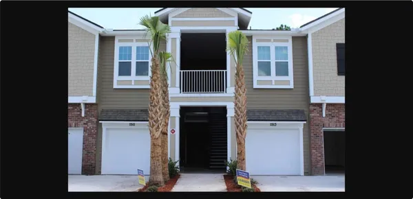 a front view of a house with a garage