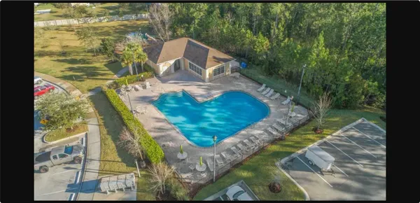 a view of swimming pool from a balcony