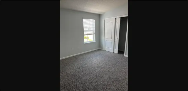 a view of a room that has a window in it