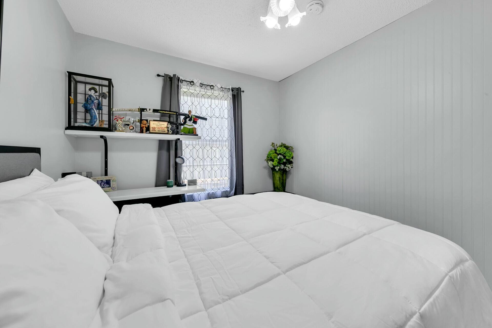 420 Apple Drive Crestview, FL 32536 - Photo 15 of 32 a bedroom with a bed dresser and window