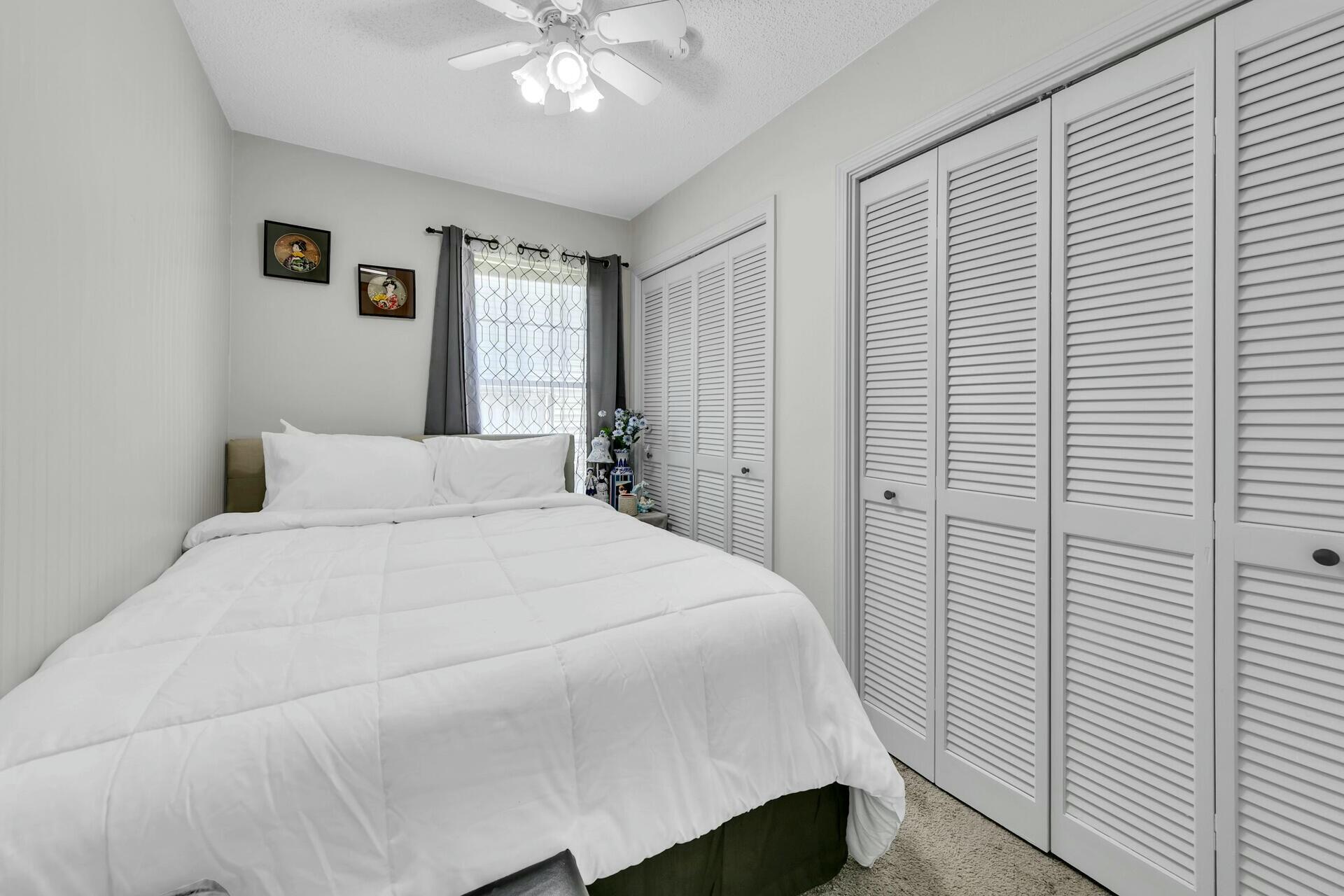 420 Apple Drive Crestview, FL 32536 - Photo 17 of 32 a large white bed in a white room