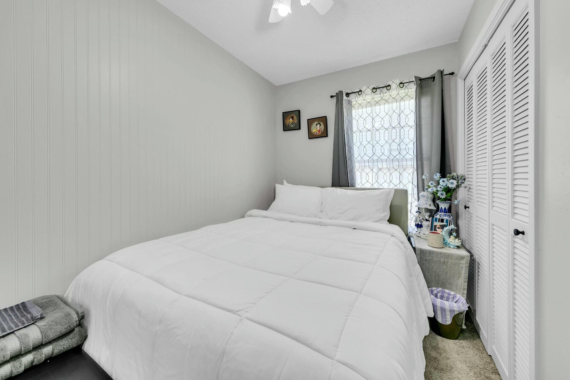 420 Apple Drive Crestview, FL 32536 - Photo 18 of 32 a bedroom with a bed and a window