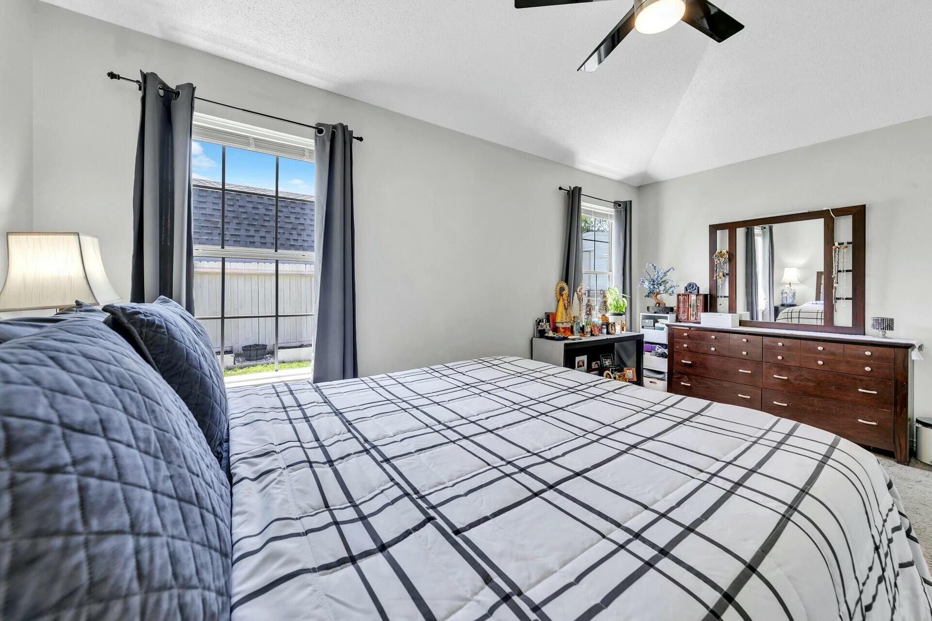 420 Apple Drive Crestview, FL 32536 - Photo 20 of 32 a bedroom with a bed and a large window