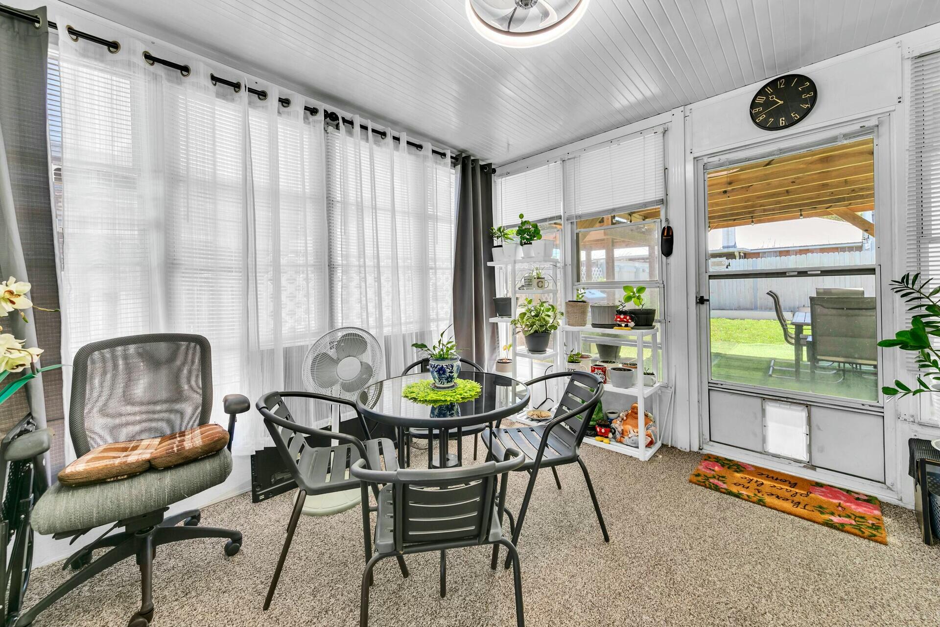 420 Apple Drive Crestview, FL 32536 - Photo 24 of 32 a dining room with furniture and a floor to ceiling window