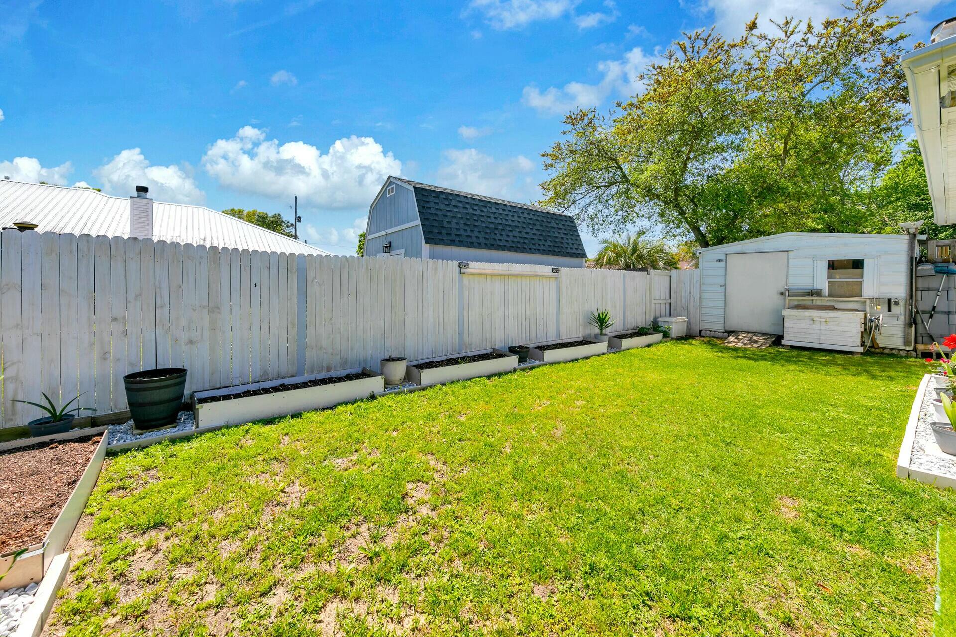 420 Apple Drive Crestview, FL 32536 - Photo 30 of 32 a backyard of a house with table and chairs