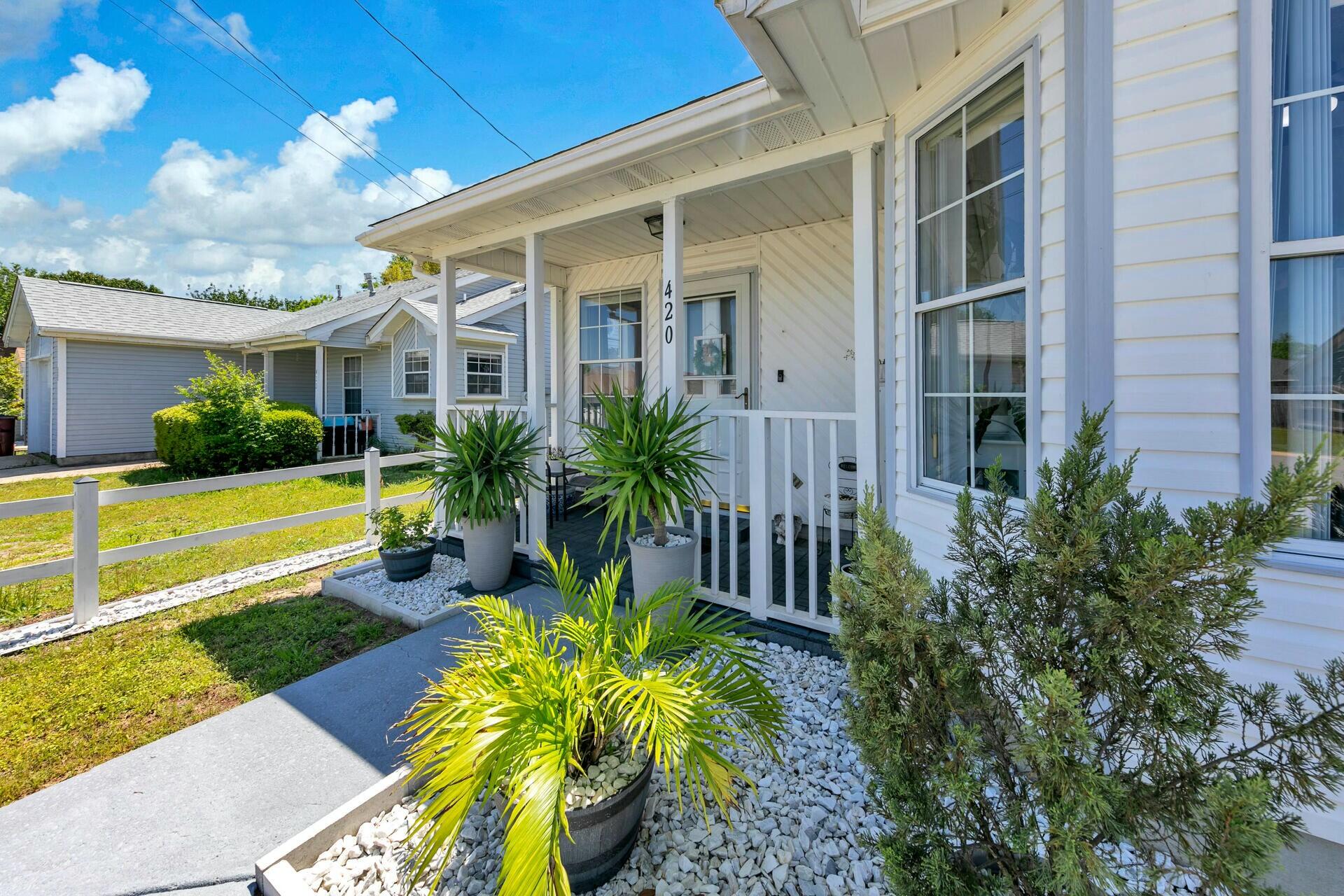 420 Apple Drive Crestview, FL 32536 - Photo 3 of 32 a front view of a house with garden
