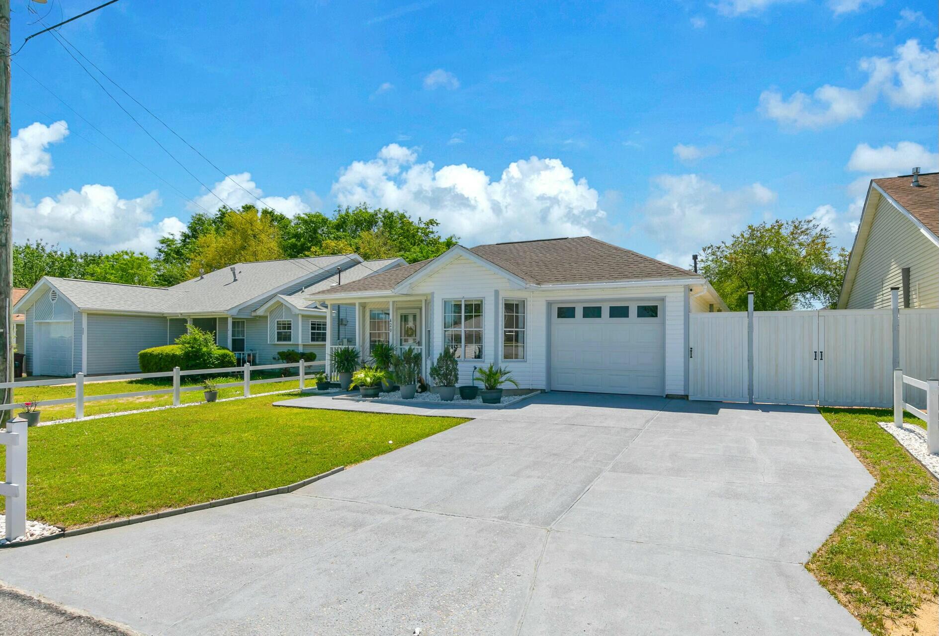 420 Apple Drive Crestview, FL 32536 - Photo 32 of 32 a front view of a house with garden