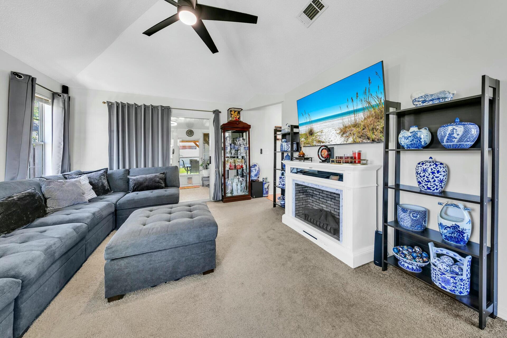 420 Apple Drive Crestview, FL 32536 - Photo 6 of 32 a living room with furniture and a flat screen tv