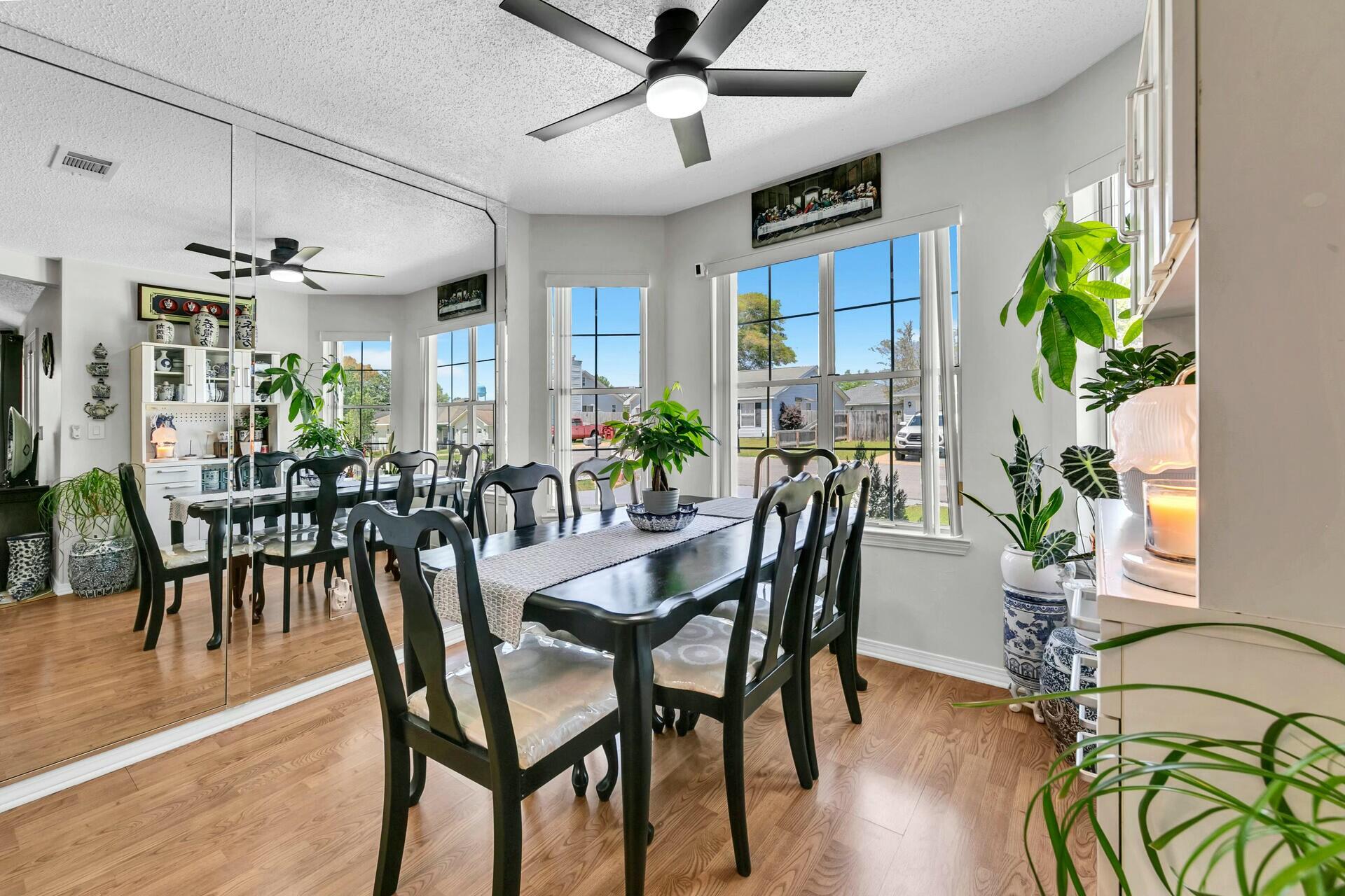420 Apple Drive Crestview, FL 32536 - Photo 8 of 32 a view of a dining room with furniture window and wooden floor