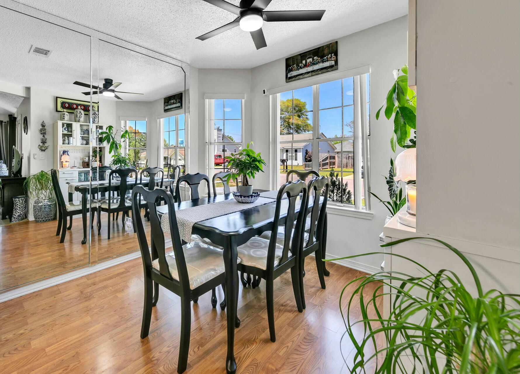 420 Apple Drive Crestview, FL 32536 - Photo 9 of 32 a view of a dining room with furniture window and wooden floor
