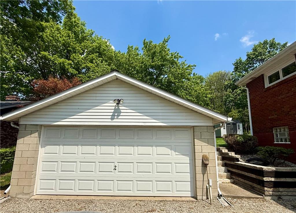 151 Huntingdon Road Wyano, PA 15695 - Photo 8 of 36 a front view of a house with garage and plants