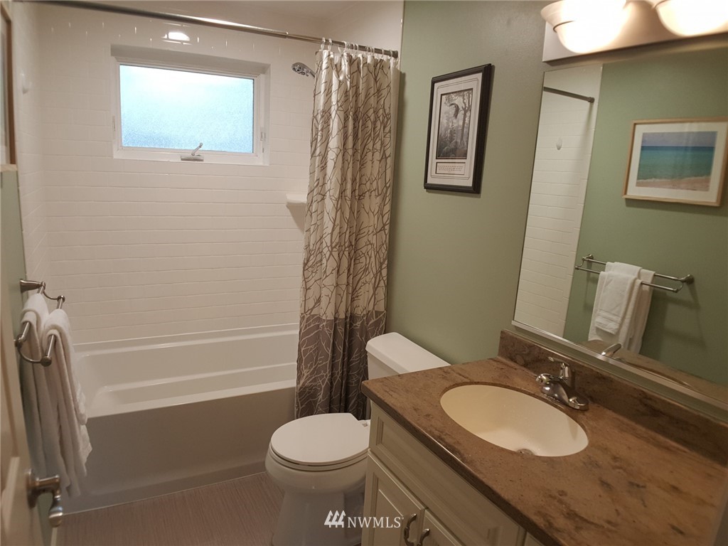 17532 Southeast 134th Street Renton, WA 98059 - Photo 22 of 24 a bathroom with a sink a toilet and shower