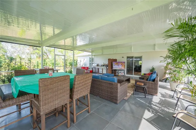 a view of a dining room with furniture window and outside view