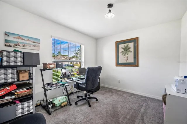 a view of a workspace with furniture and toys