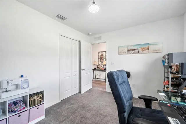 a kitchen with a stove a sink a microwave a dining table and chairs