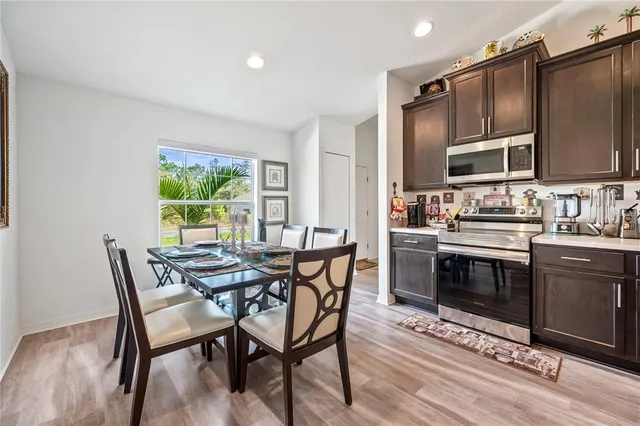 a kitchen with a sink a stove and cabinets