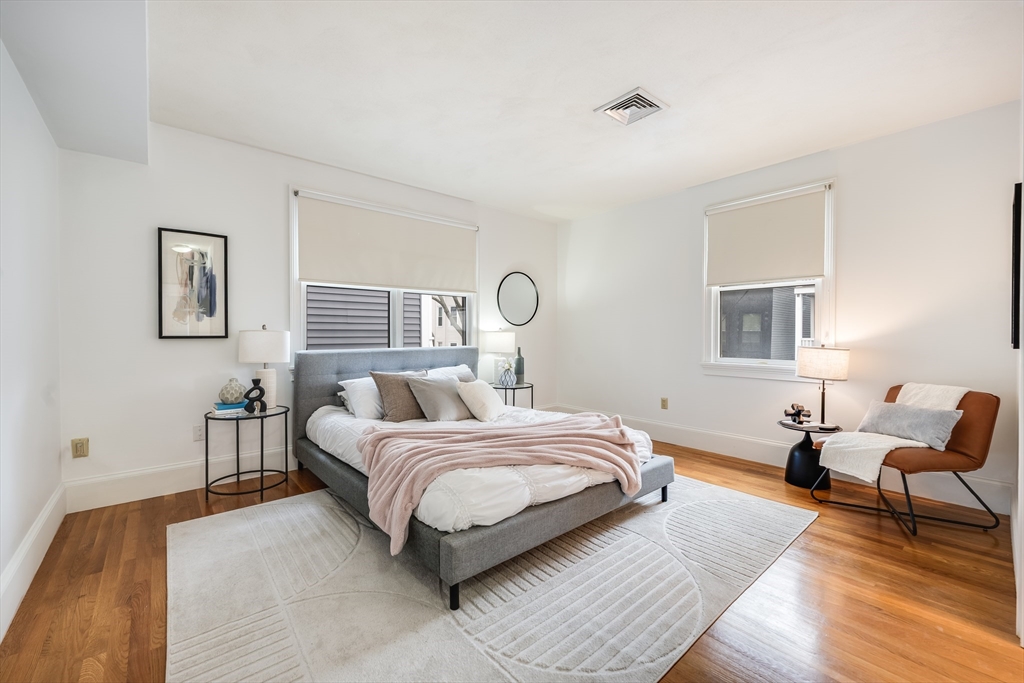 1520 Columbia Road, Unit 2 Boston, MA 02127 - Photo 10 of 16 a bed room with a bed and a chair
