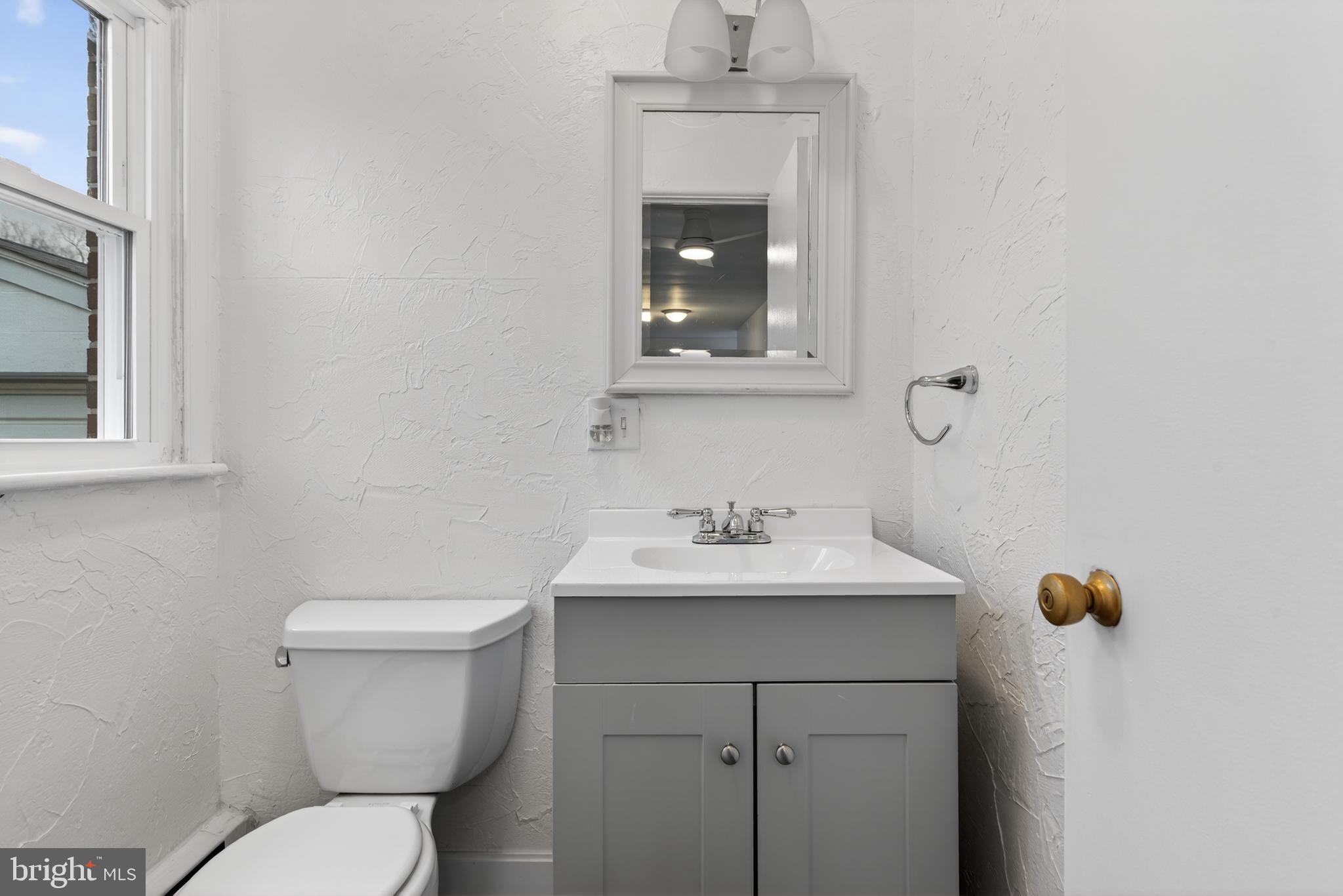 10 Dixie Drive Red Lion, PA 17356 - Photo 13 of 32 a bathroom with a toilet sink and mirror