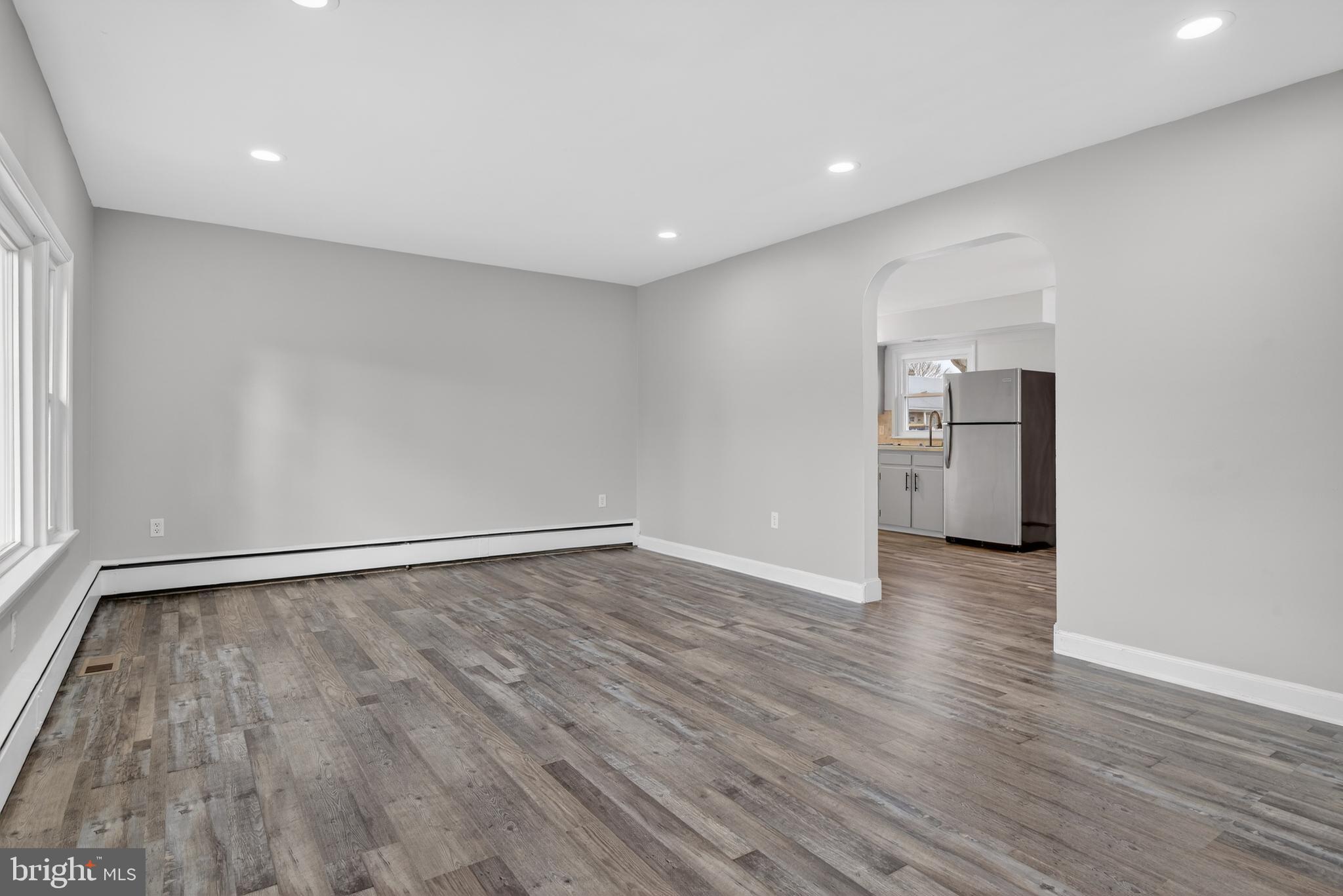 10 Dixie Drive Red Lion, PA 17356 - Photo 5 of 32 a view of an empty room with wooden floor and a window