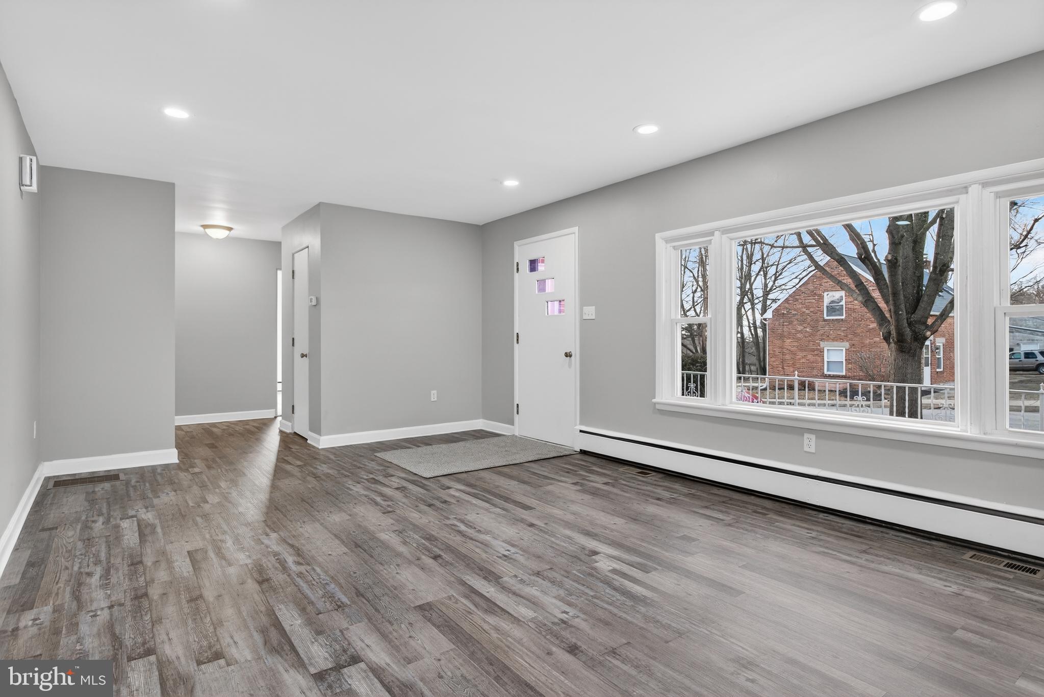 10 Dixie Drive Red Lion, PA 17356 - Photo 6 of 32 a view of an empty room with wooden floor and a window