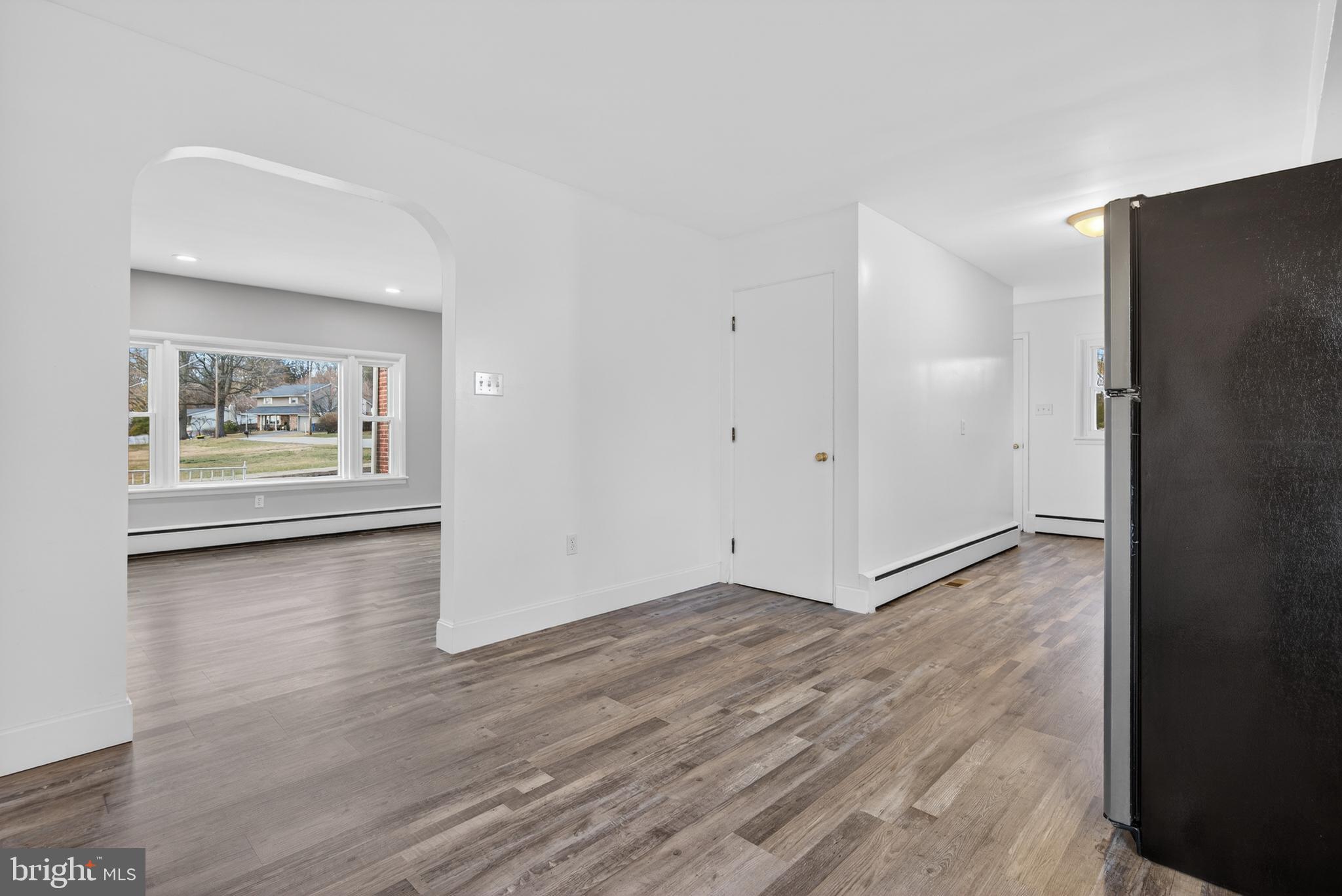 10 Dixie Drive Red Lion, PA 17356 - Photo 9 of 32 a view of an empty room with wooden floor and a window