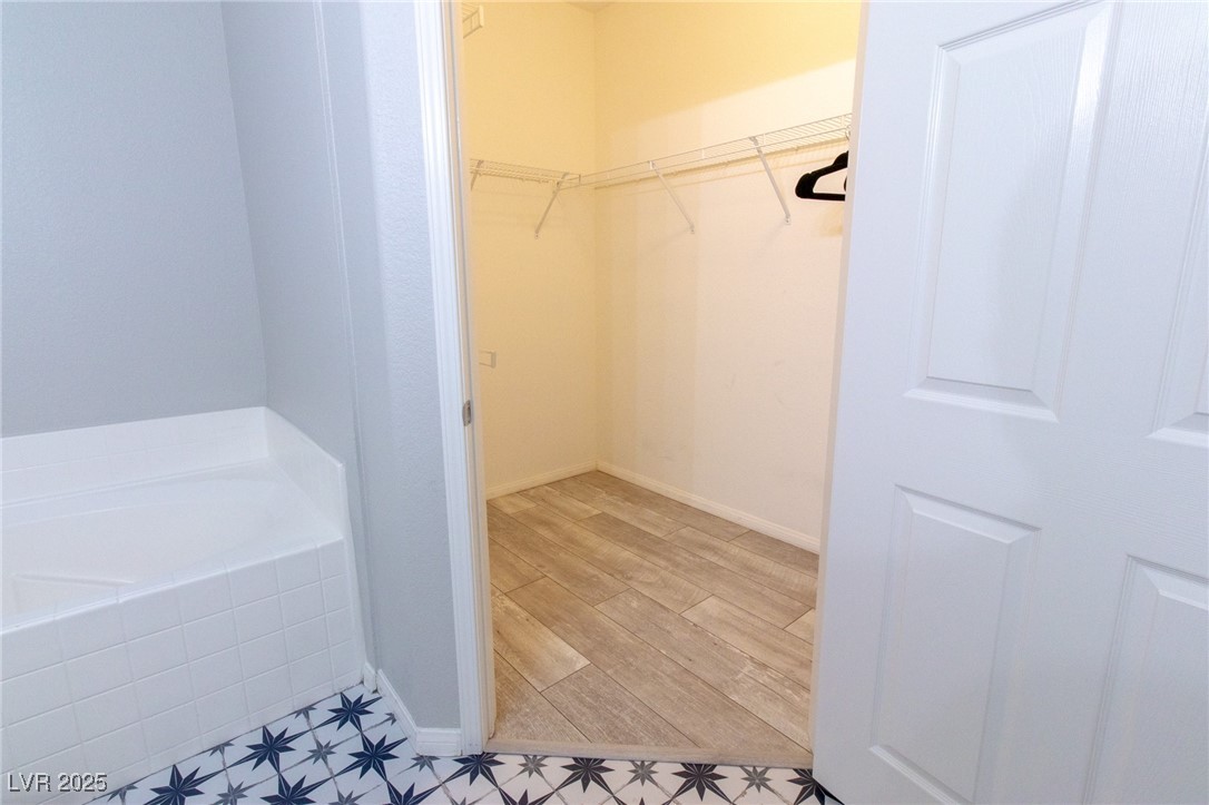10550 West Alexander Road, Unit 2068 Las Vegas, NV 89129 - Photo 20 of 47 Walk in closet with light wood-type flooring