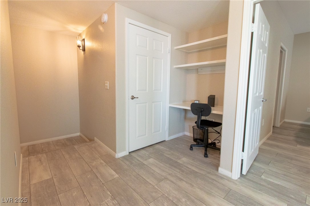 10550 West Alexander Road, Unit 2068 Las Vegas, NV 89129 - Photo 25 of 47 Office space featuring light wood-style flooring and built in desk