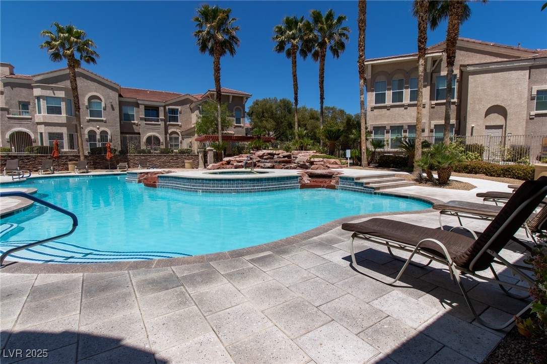 10550 West Alexander Road, Unit 2068 Las Vegas, NV 89129 - Photo 44 of 47 Community pool with a community hot tub and a patio