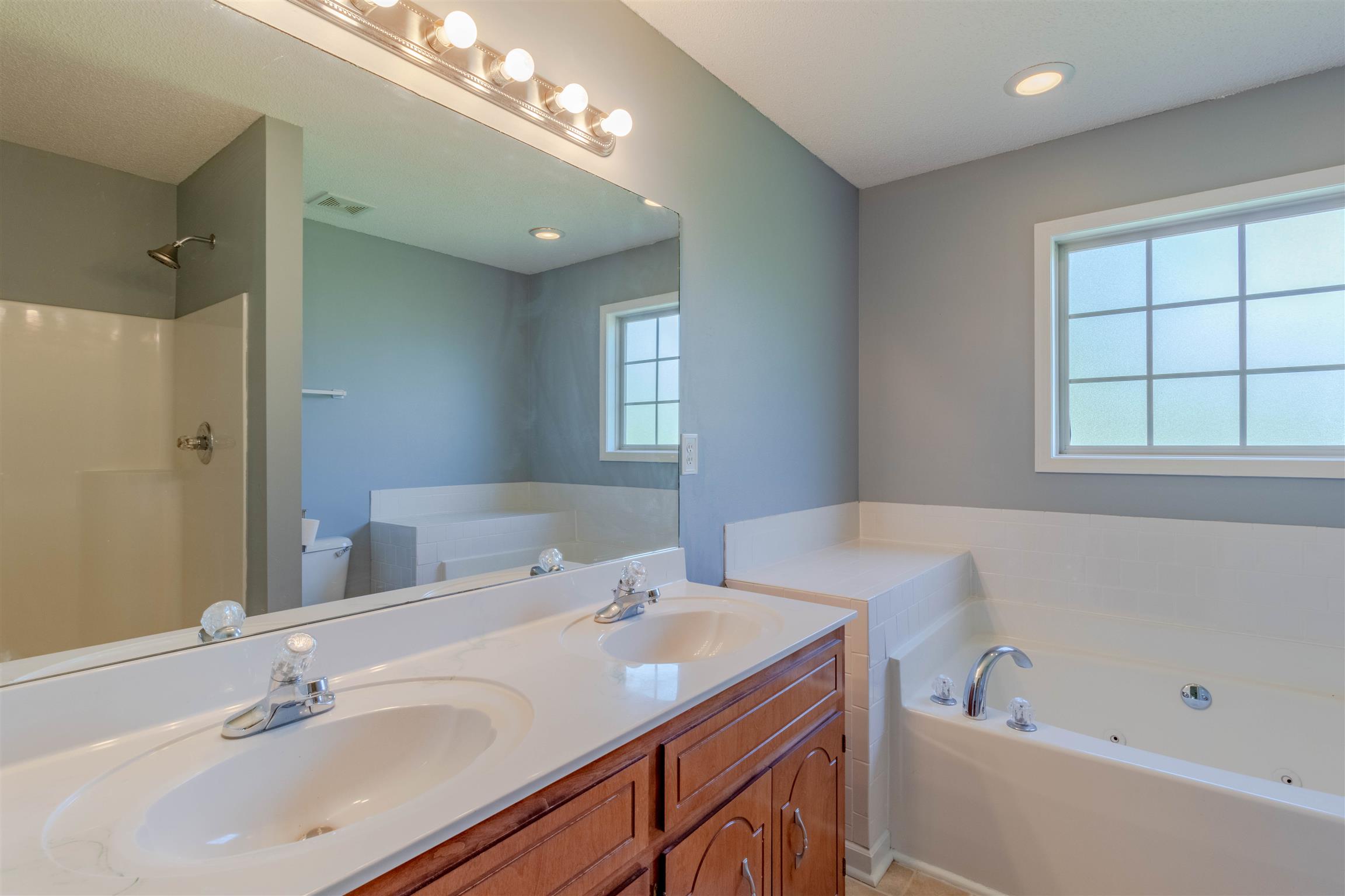 1923 Needmore Road Clarksville, TN 37042 - Photo 14 of 28 Master bath features double vanities and a jetted tub