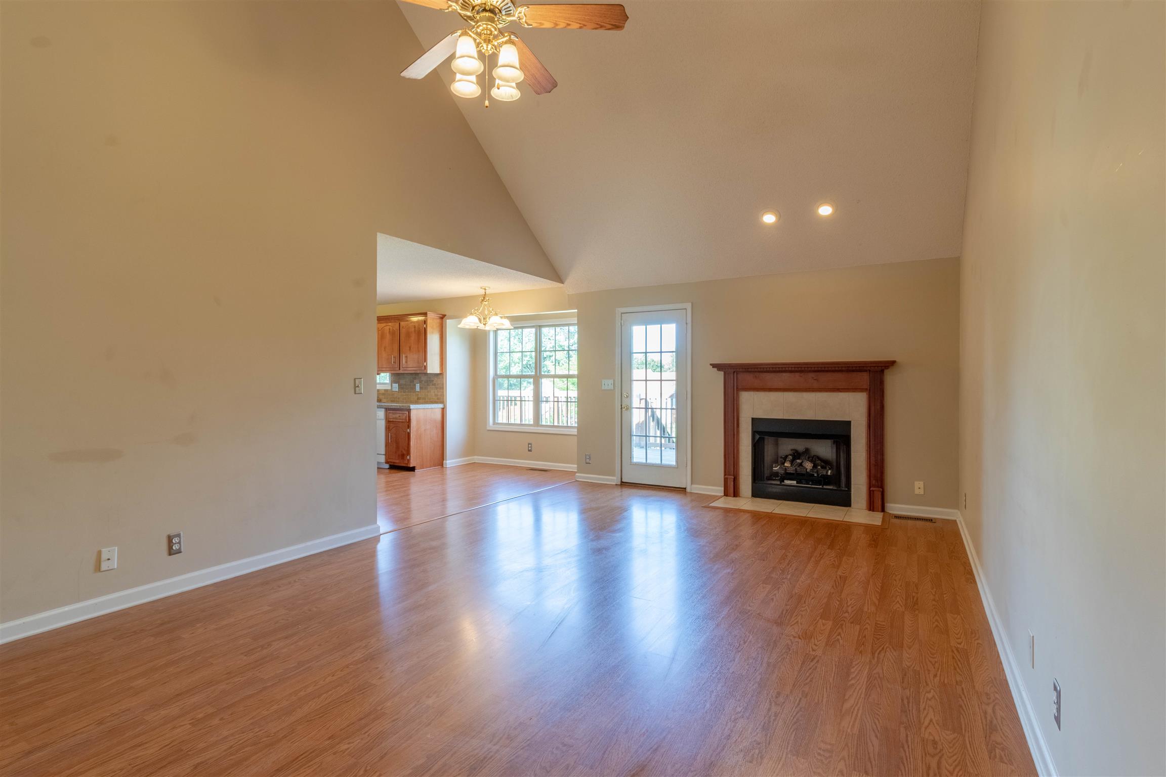 1923 Needmore Road Clarksville, TN 37042 - Photo 4 of 28 Enter into the large living room area featuring a fireplace. Open to the kitchen and lots of natural light.