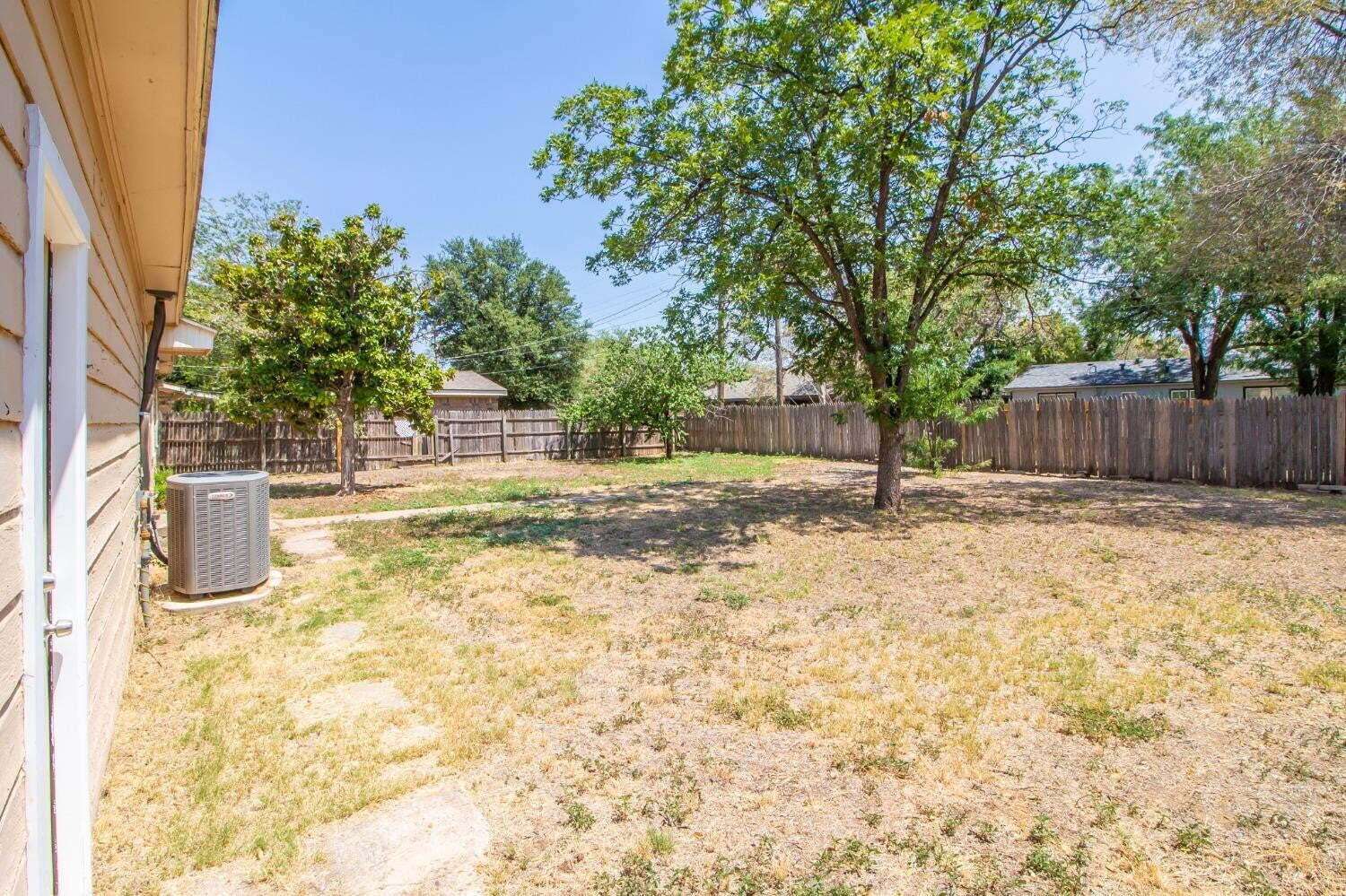 3813 35th Street Lubbock, TX 79413 - Photo 16 of 18 a view of back yard of the house