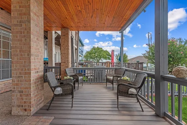 a view of a patio with a table chairs and a couches