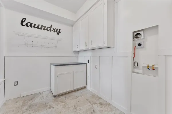 a view of a balcony with wooden floor and outdoor seating
