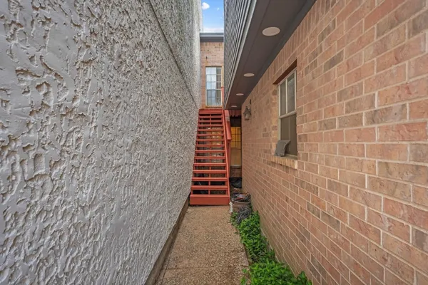 a view of balcony with furniture and wooden deck