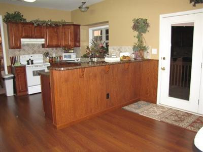 372 Winton Road Versailles, KY 40383 - Photo 13 of 22 Breakfast bar with cherry wood finish to