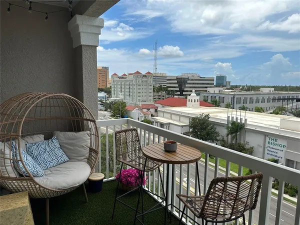 a view of a balcony with furniture