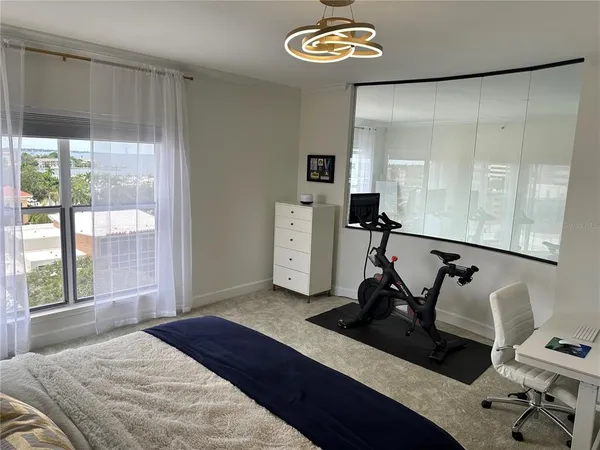 a bedroom with a bed and cabinets
