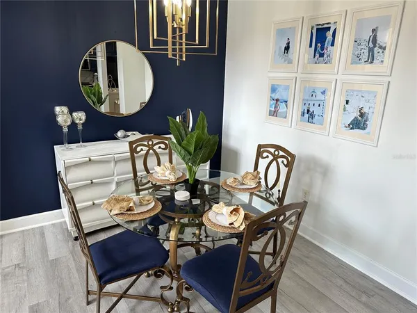 a view of a dining room with furniture and wooden floor