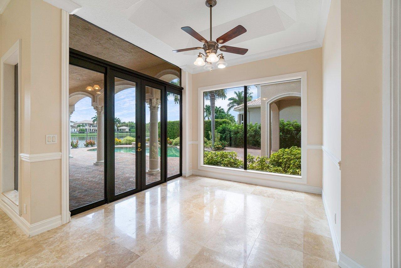 9636 Bridgebrook Drive Boca Raton, FL 33496 - Photo 14 of 50 a view of a livingroom with a ceiling fan and a large window