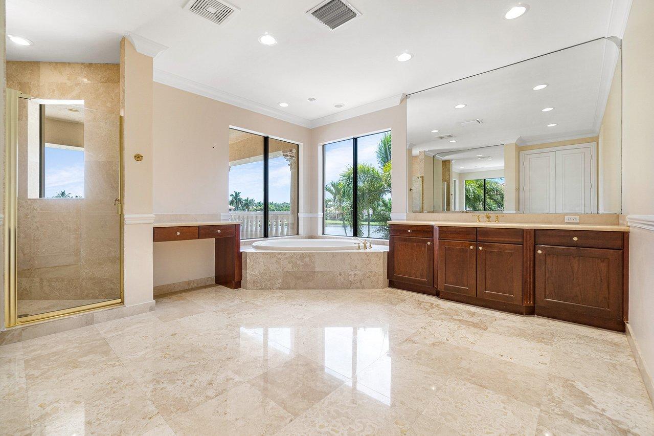 9636 Bridgebrook Drive Boca Raton, FL 33496 - Photo 23 of 50 a large bathroom with a large tub shower and sink