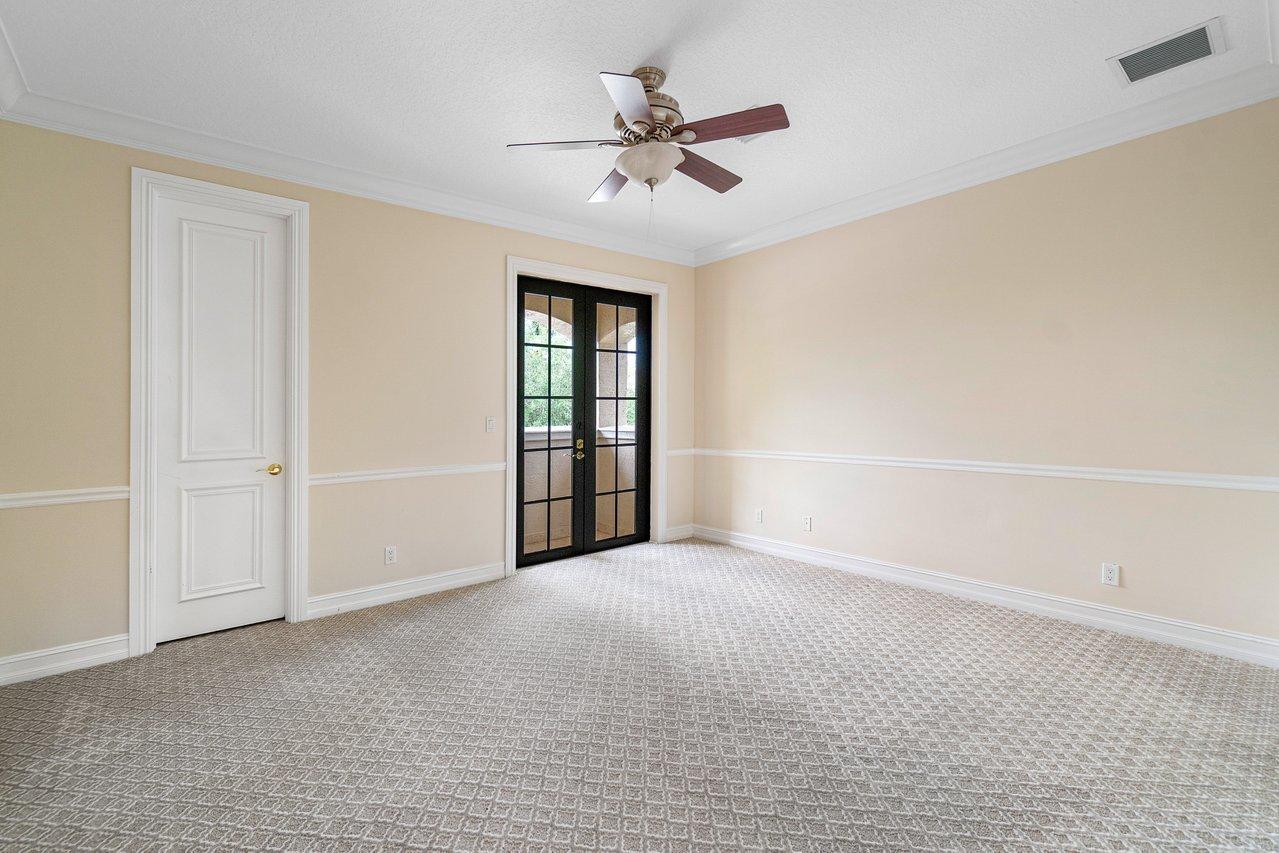 9636 Bridgebrook Drive Boca Raton, FL 33496 - Photo 26 of 50 a view of an empty room with a ceiling fan