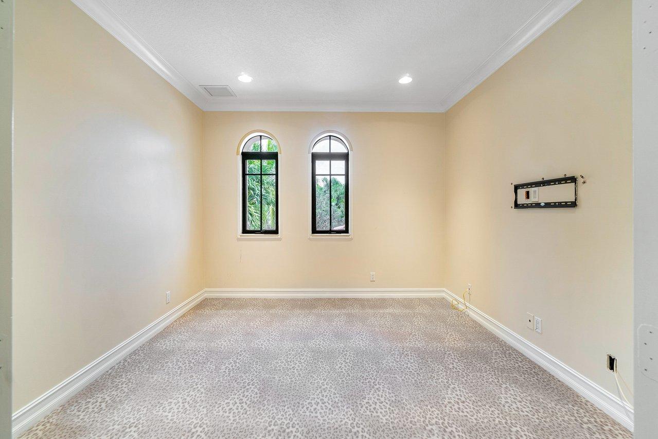 9636 Bridgebrook Drive Boca Raton, FL 33496 - Photo 28 of 50 an empty room with windows and closet