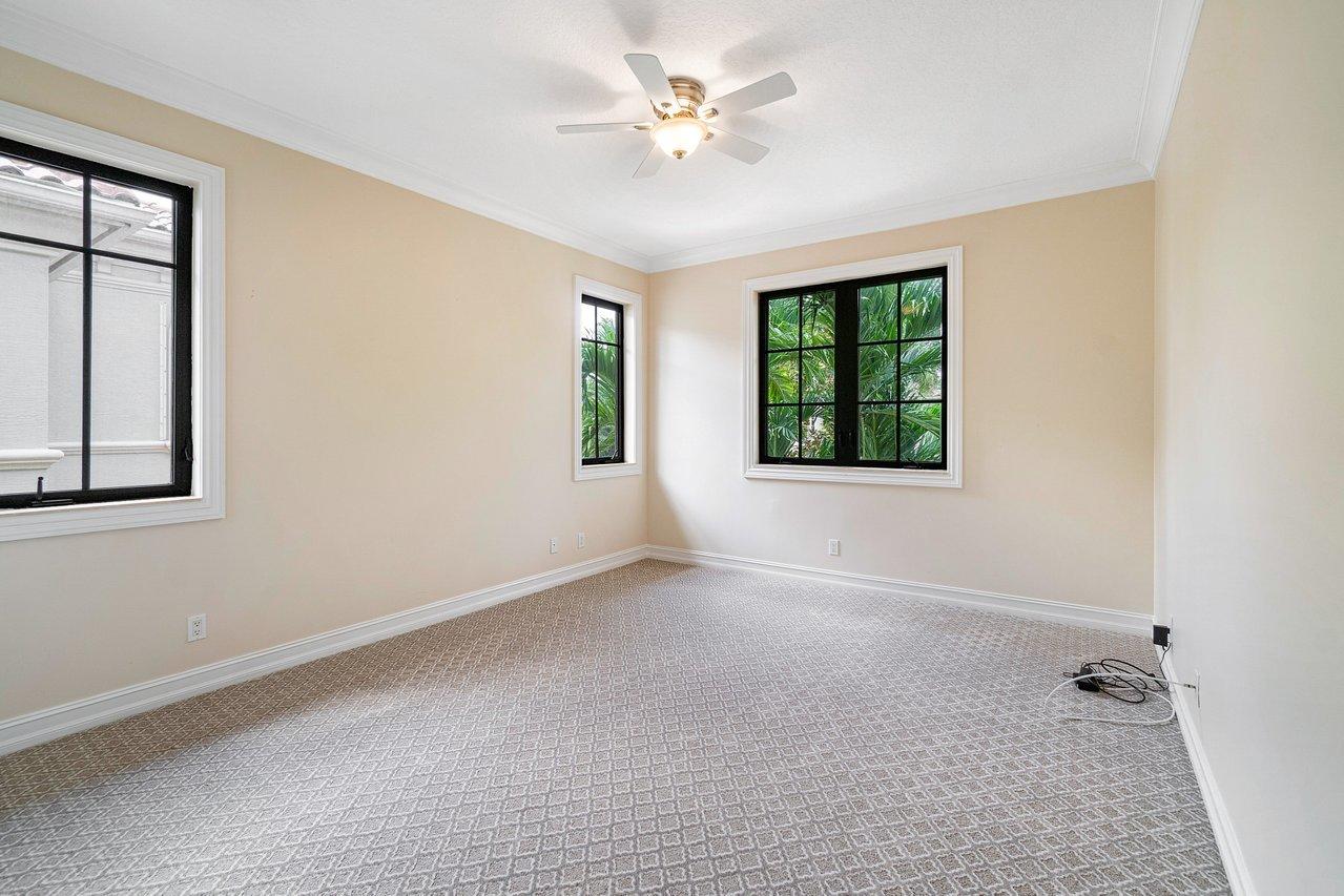 9636 Bridgebrook Drive Boca Raton, FL 33496 - Photo 31 of 50 an empty room with windows and ceiling fan