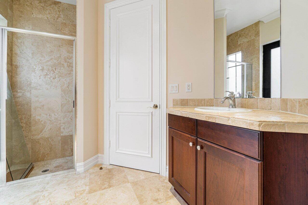 9636 Bridgebrook Drive Boca Raton, FL 33496 - Photo 35 of 50 a bathroom with a sink and a mirror