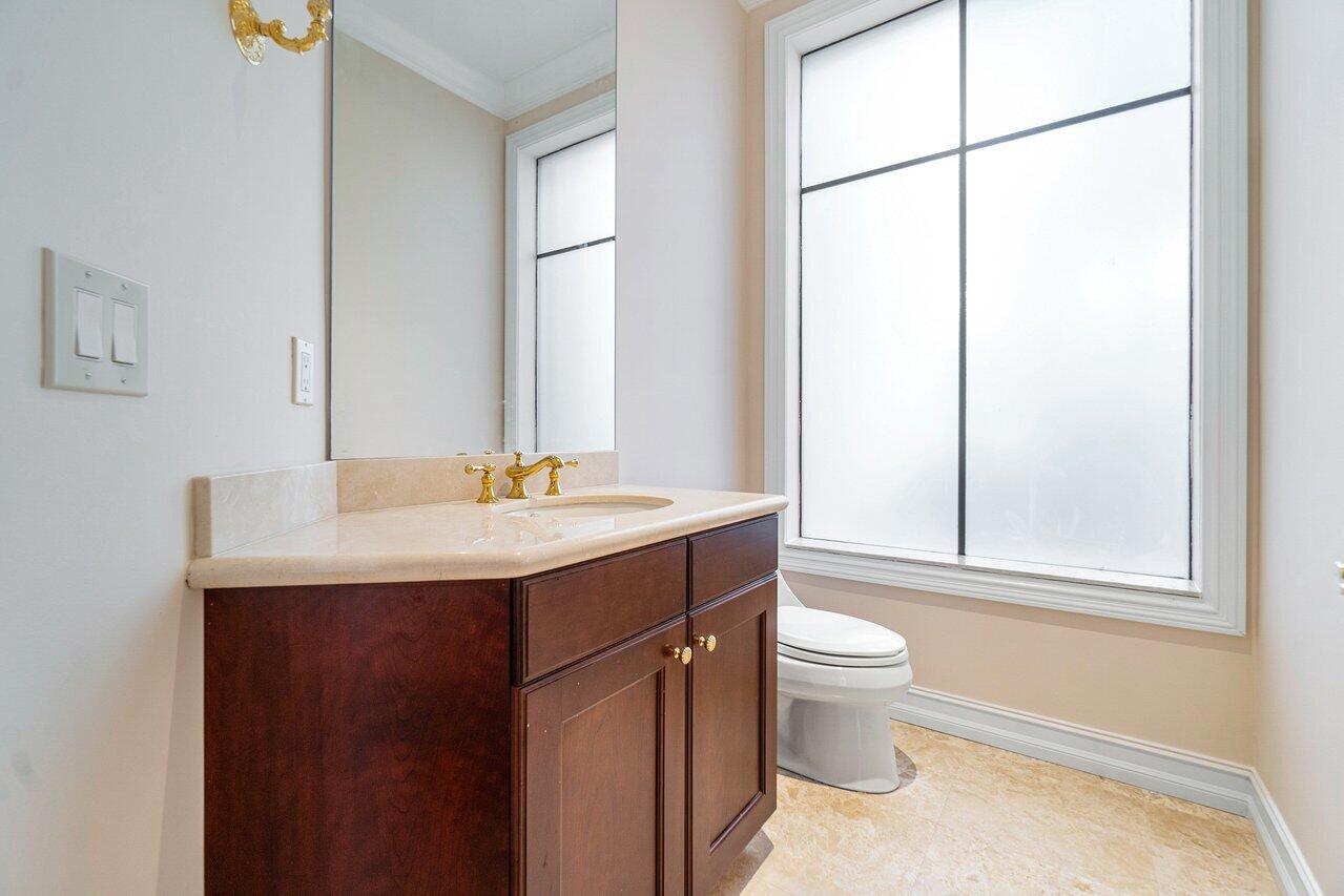 9636 Bridgebrook Drive Boca Raton, FL 33496 - Photo 37 of 50 a bathroom with a sink toilet and mirror