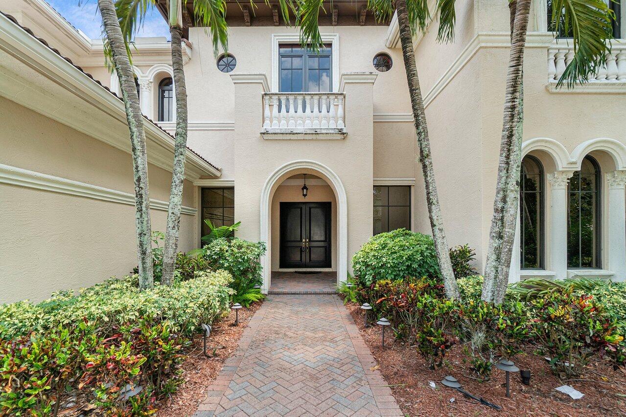 9636 Bridgebrook Drive Boca Raton, FL 33496 - Photo 4 of 50 a front view of a house with garden
