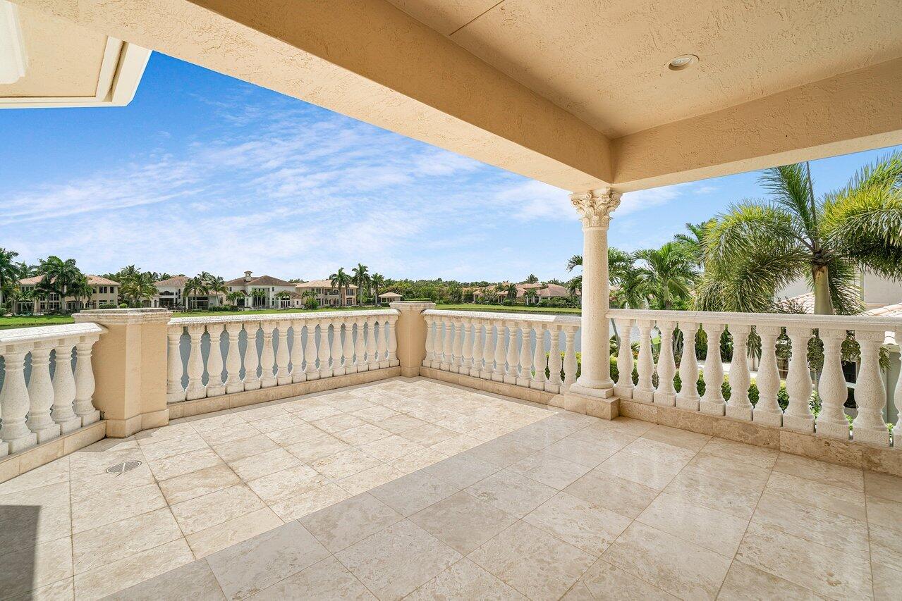 9636 Bridgebrook Drive Boca Raton, FL 33496 - Photo 43 of 50 a view of a balcony with wooden fence