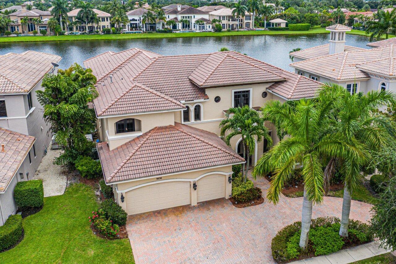 9636 Bridgebrook Drive Boca Raton, FL 33496 - Photo 49 of 50 an aerial view of a house with garden space and a lake view